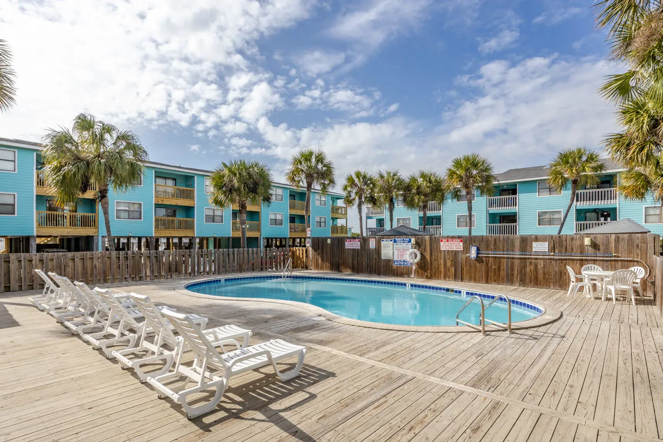 Adults pool with row of lounge chairs