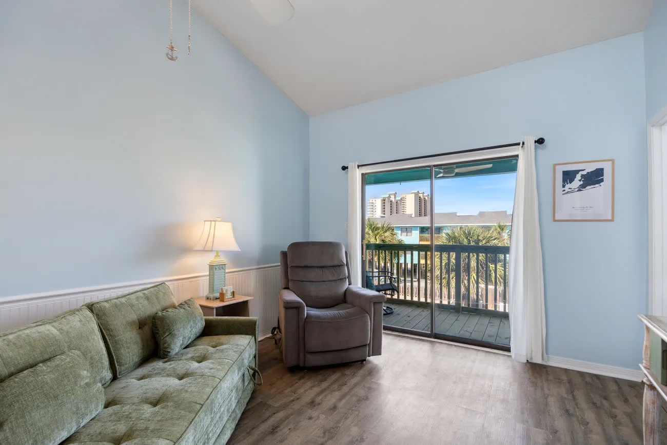 Sofa and recliner with sliding door to private balcony