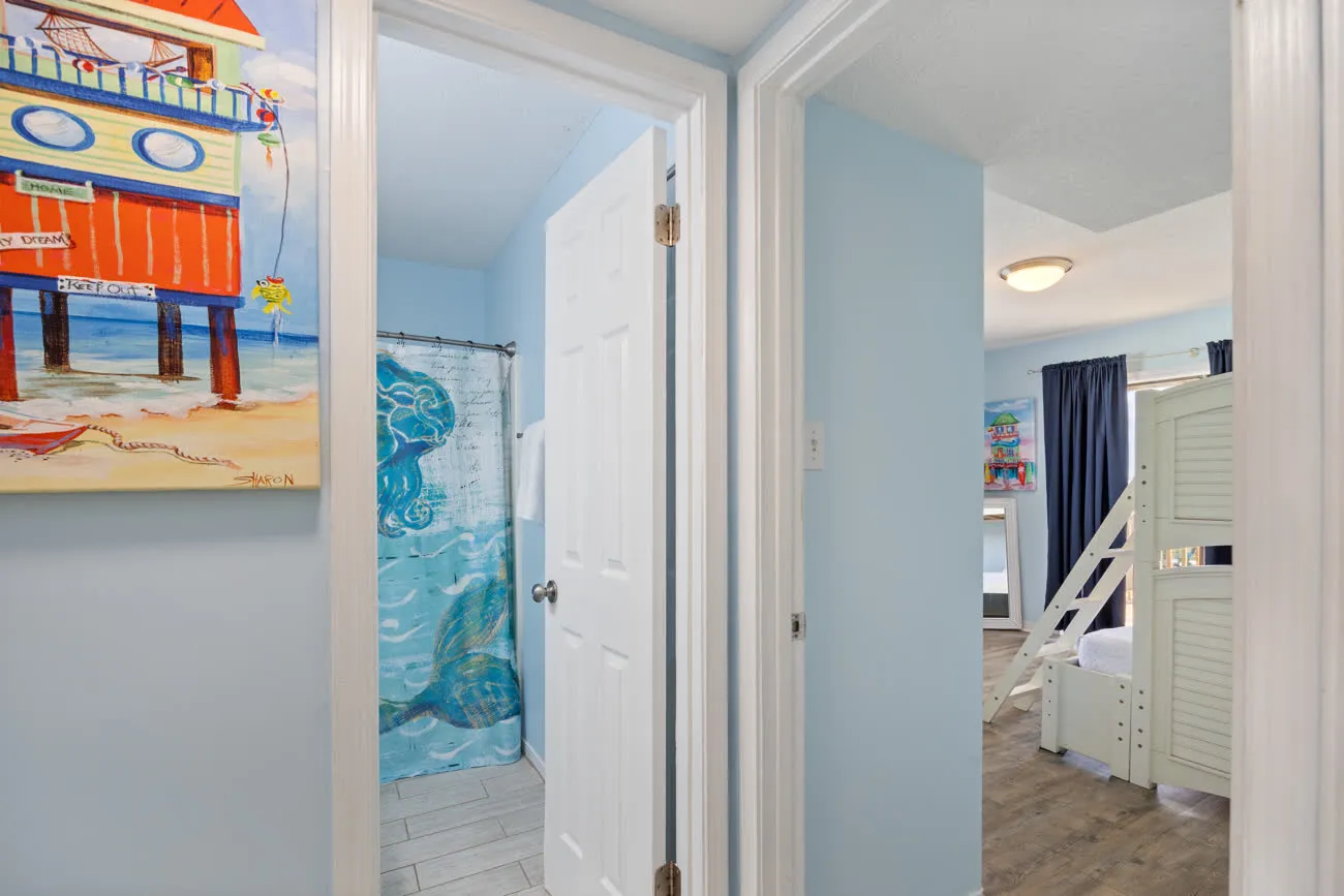 Hall bathroom doorway with mermaid shower curtain