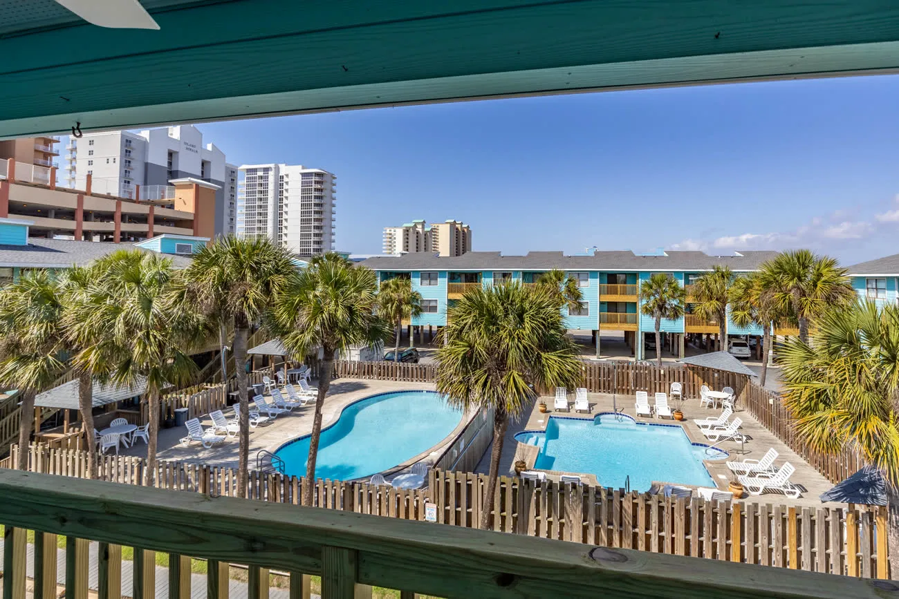 Pool overlook with high-rise condo in distance