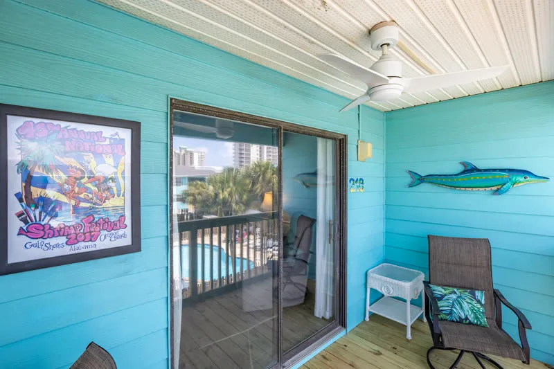 Balcony detail with fish art and sliding glass door