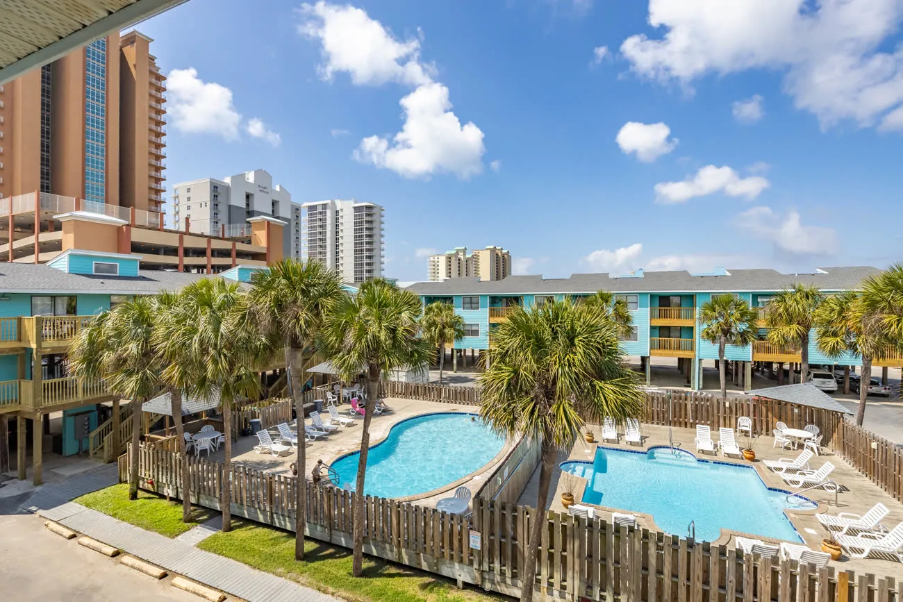 Both pools with high-rise condo in background