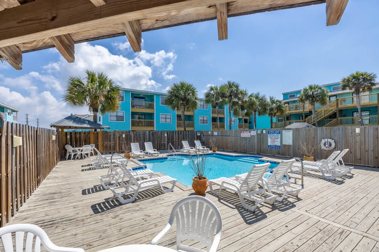 Adults-only pool from corner with lounge chairs